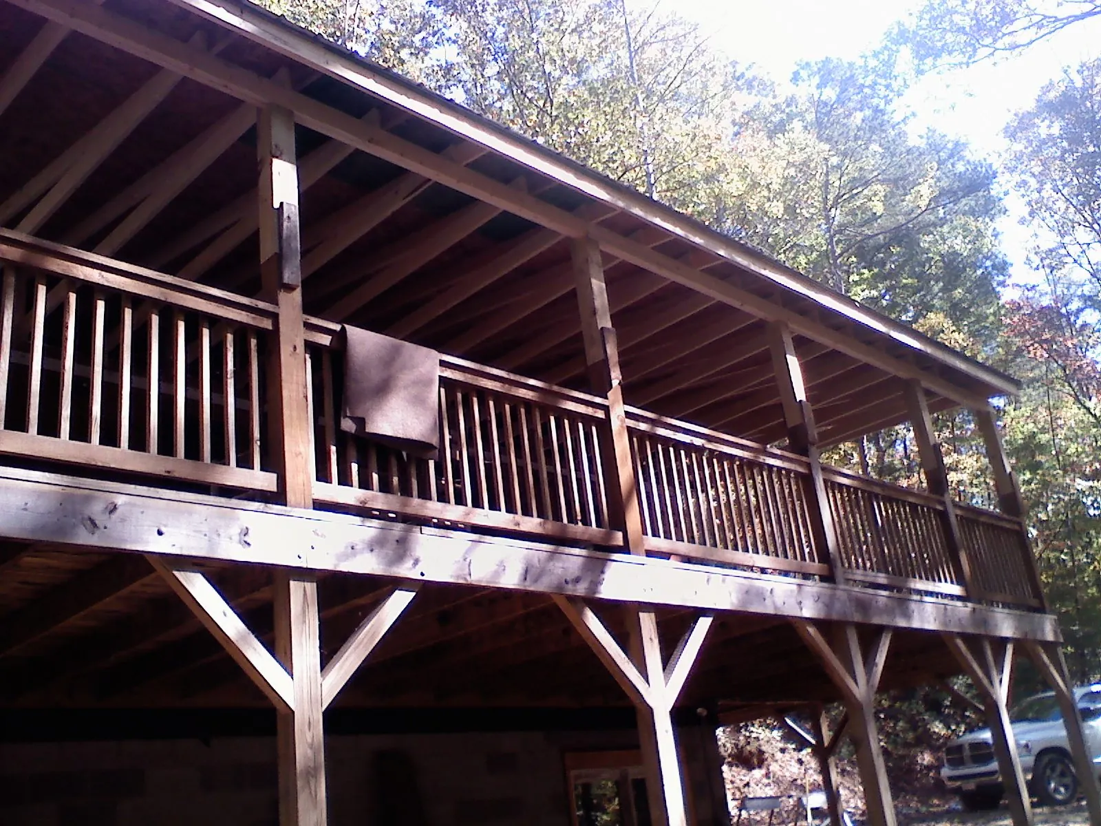 Timber framing under a new elevated porch and deck — Roof Leak Repair in West New York by Roofing Brothers